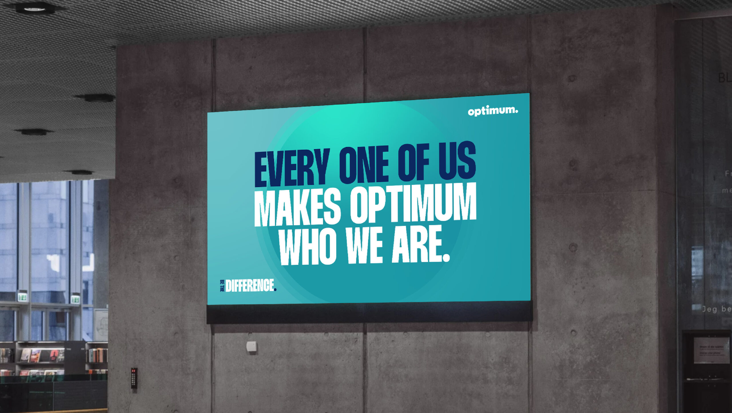 Office screen reading 'Every one of us makes Optimum who we are'