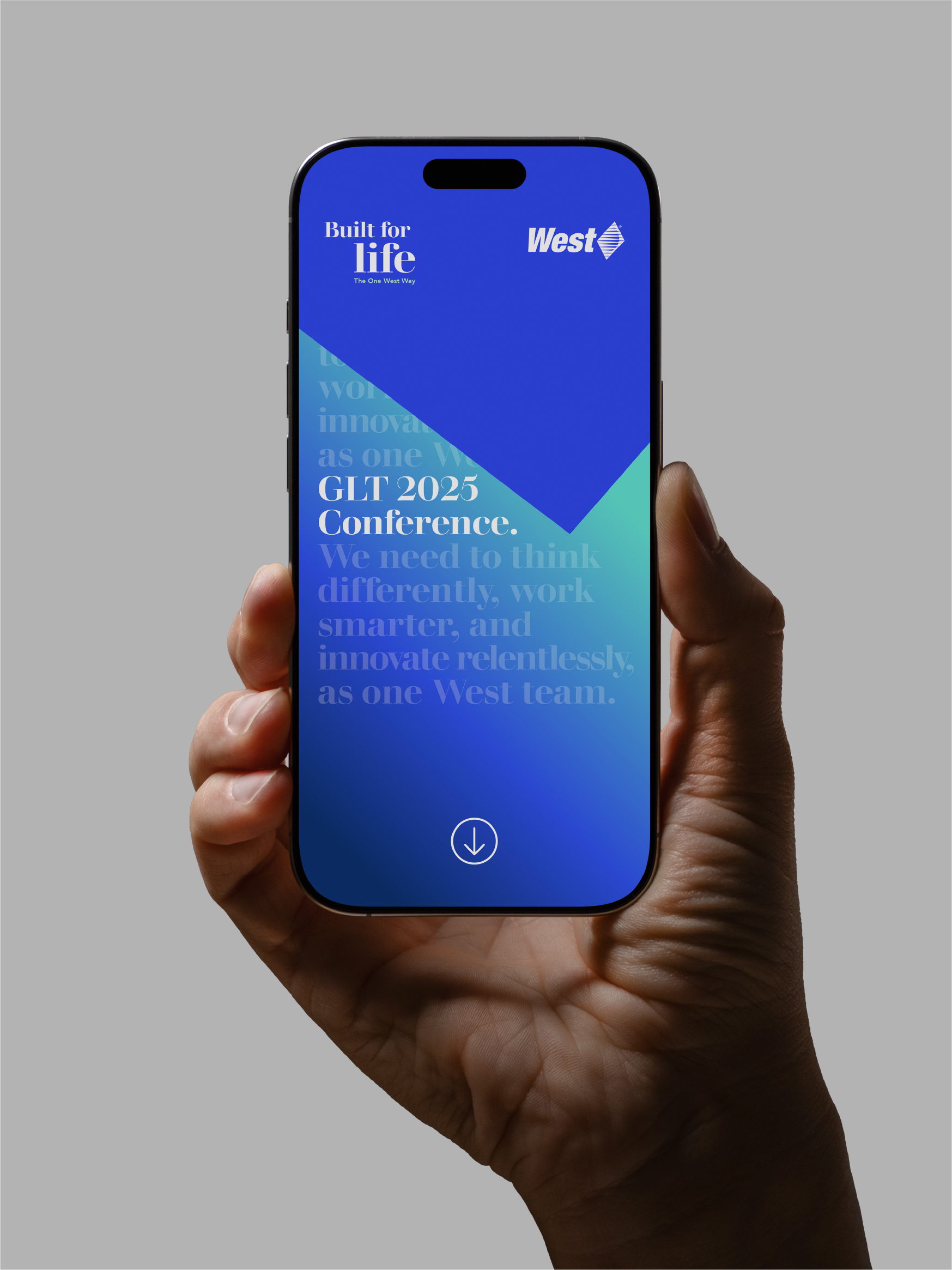 Hand holding a phone showing West conference branding